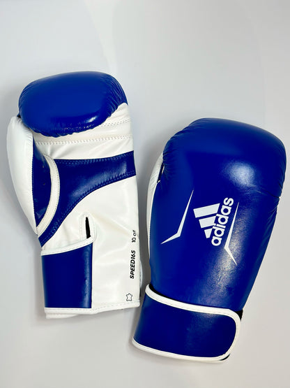 Adidas WAKO Approved Kickboxing Fight Gloves, Cowhide Cuir Leather Speed 165 adiSBG165 Competition Gloves 10 Oz Blue on Floor