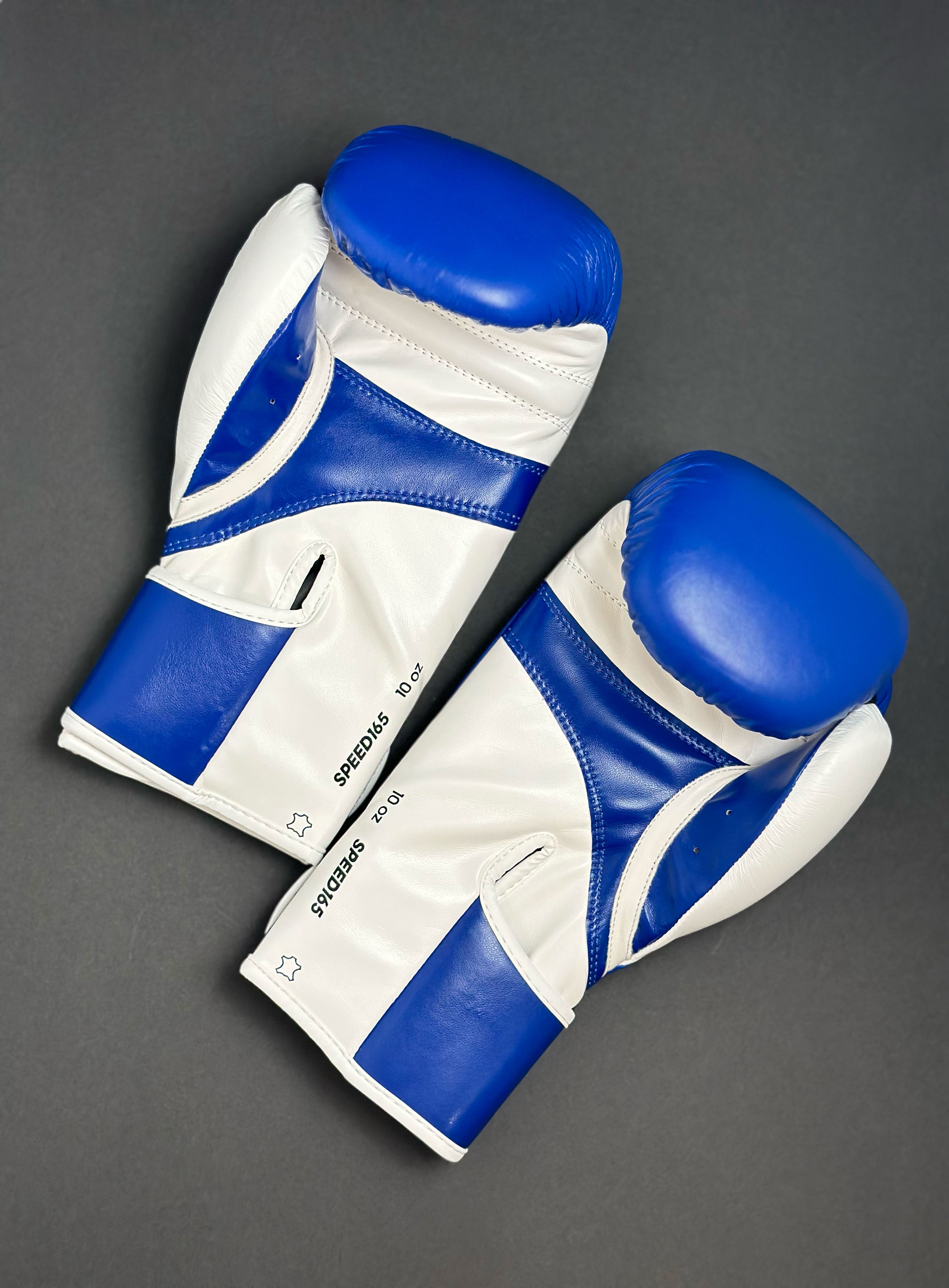 Adidas WAKO Approved Kickboxing Fight Gloves, Cowhide Cuir Leather Speed 165 adiSBG165 Competition Gloves 10 Oz Blue pair on Floor