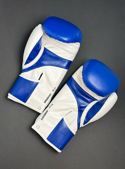 Adidas WAKO Approved Kickboxing Fight Gloves, Cowhide Cuir Leather Speed 165 adiSBG165 Competition Gloves 10 Oz Blue pair on Floor